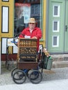 Busker playing barrel organ