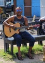 A busker plays his guitar in Grand-baie, Mauritius