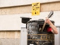 Busker singing and playing guitar inside a rubbish bin Royalty Free Stock Photo