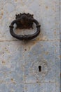 Vertical view. Knocker and lock of the main door of the San Lorenzo Martir Church, 16th century. Busot, Alicante, Spain