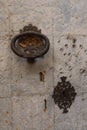 Vertical view. Knocker and lock of one of the doors of the San Lorenzo Martir Church, 16th century. Busot, Alicante, Spain