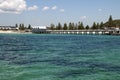 View of jetty from ocean looking back to shore Royalty Free Stock Photo