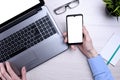 Bussines wooden office desk workplace with blank cellphone, various supplies. School, education, technology and advertisement Royalty Free Stock Photo