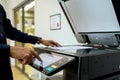 Bussiness man Hand press button on panel of printer, printer scanner laser office Royalty Free Stock Photo