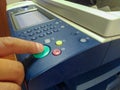 Bussiness man Hand press button on panel of printer, printer scanner laser office copy machine supplies start concept Royalty Free Stock Photo