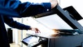 Bussiness man Hand press button on panel of printer, printer scanner laser office copy machine supplies start concept Royalty Free Stock Photo