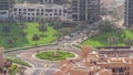 Bussy traffic on the road intersection in Dubai downtown aerial timelapse, UAE