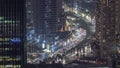 Bussy traffic on the intersection in Dubai downtown aerial night timelapse. Royalty Free Stock Photo