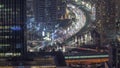 Bussy traffic on the intersection in Dubai downtown aerial night timelapse. Royalty Free Stock Photo