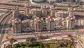 Bussy traffic on the overpass intersection in Dubai downtown aerial timelapse.