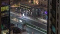 Bussy traffic on the road intersection in Dubai downtown aerial night timelapse, UAE