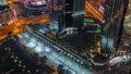 Bussy traffic on the road intersection in Dubai downtown aerial night timelapse. Royalty Free Stock Photo