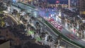 Bussy traffic on the road intersection in Dubai downtown aerial night timelapse, UAE Royalty Free Stock Photo