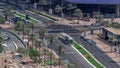 Bussy traffic on the road intersection in Dubai downtown aerial timelapse, UAE