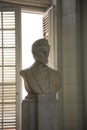 Bust of Abraham Lincoln in front of a window