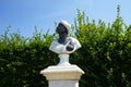 A bust of an African woman is placed on a pedestal in the park. Potsdam, Germany