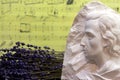 Bust of Chopin and lavender flowers on background of sheet music. Composition in musical room.