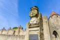 The bust of the famous Dame Carcass at the entrance of the drawbridge to the medieval fortress of Carcassonne. Royalty Free Stock Photo