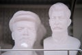 Bust of Lenin and Stalin on the shelf of a tourist shop, plaster sculpture - Moscow, Russia, April 23, 2021