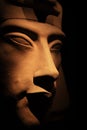 Bust of pharaoh Echnaton Akhenaten, aka Amenhotep IV around black background . cloes up