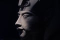 Bust of pharaoh Echnaton Akhenaten, aka Amenhotep IV around black background . cloes up