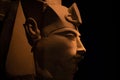 Bust of pharaoh Echnaton Akhenaten, aka Amenhotep IV around black background . cloes up