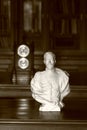 Bust of Russian Emperor Nicholas II on the table. Monochrome, sepia