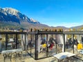 Busteni, Romania - December 30, 2022: Sunny landscape with Bucegi mountains and Busteni ski resort in Romania.