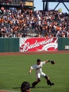 Buster Posey steps to throw ball warming up