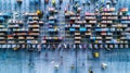 the bustling activity within a warehouse as workers navigate among towering shelves filled with cardboard boxes, seen Royalty Free Stock Photo