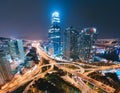 Bustling city at night with illuminated streets and skyscrapers