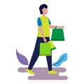 A cute boy is carrying a shopping bag