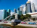 Bustling cityscape near the Singapore Merlion fountain on the sunny day Royalty Free Stock Photo