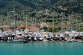 Bustling Marina with Yachts in Mountainous Setting