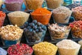 Bustling marketplace filled with vibrant colors of aromatic spices and succulent fruits
