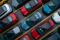 A bustling parking lot with numerous cars of different colors lining up, creating a vibrant and colorful scene, Top view of an Royalty Free Stock Photo