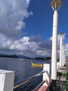 A bustling sea dock, adorned with numerous ships, set against a clear and vibrant sky. Royalty Free Stock Photo