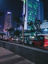 Bustling street atmosphere in front of the BNI City busway stop