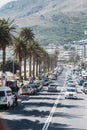 Bustling Traffic Along the Boulevard In Camps Bay, South Africa, Under The Mountain Royalty Free Stock Photo