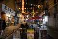 Bustling urban street lined with small shops and eateries in New York, United States