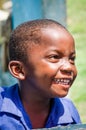 Portrait of unidentified young African boy laughing