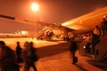 Busy airport at night. Hurry passangers. Royalty Free Stock Photo