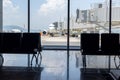 A busy airport tarmac runway with various commercial aircraft planes parked near the terminals Royalty Free Stock Photo