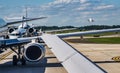 Busy airport tarmac traffic before airplanes take off Royalty Free Stock Photo