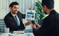Busy analyst team discussing financial data on laptop and phone. Fervent Royalty Free Stock Photo
