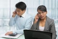 Busy Asian business people on the phone Royalty Free Stock Photo