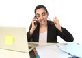 Busy attractive woman in business suit working in stress desperate overwhelmed Royalty Free Stock Photo