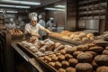 busy bakery, with various breads being baked and scored for sale