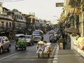 Busy bangkok street showing local transport and a local way of life