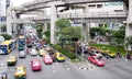 Busy Bangkok traffic on Phaya Thai road with the Skytrain track overhead, Bangkok, Thailand
